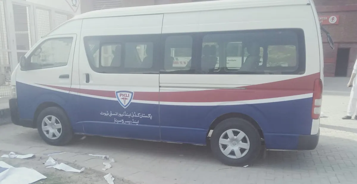 A white hospital van with fresh blue and green branding along its side