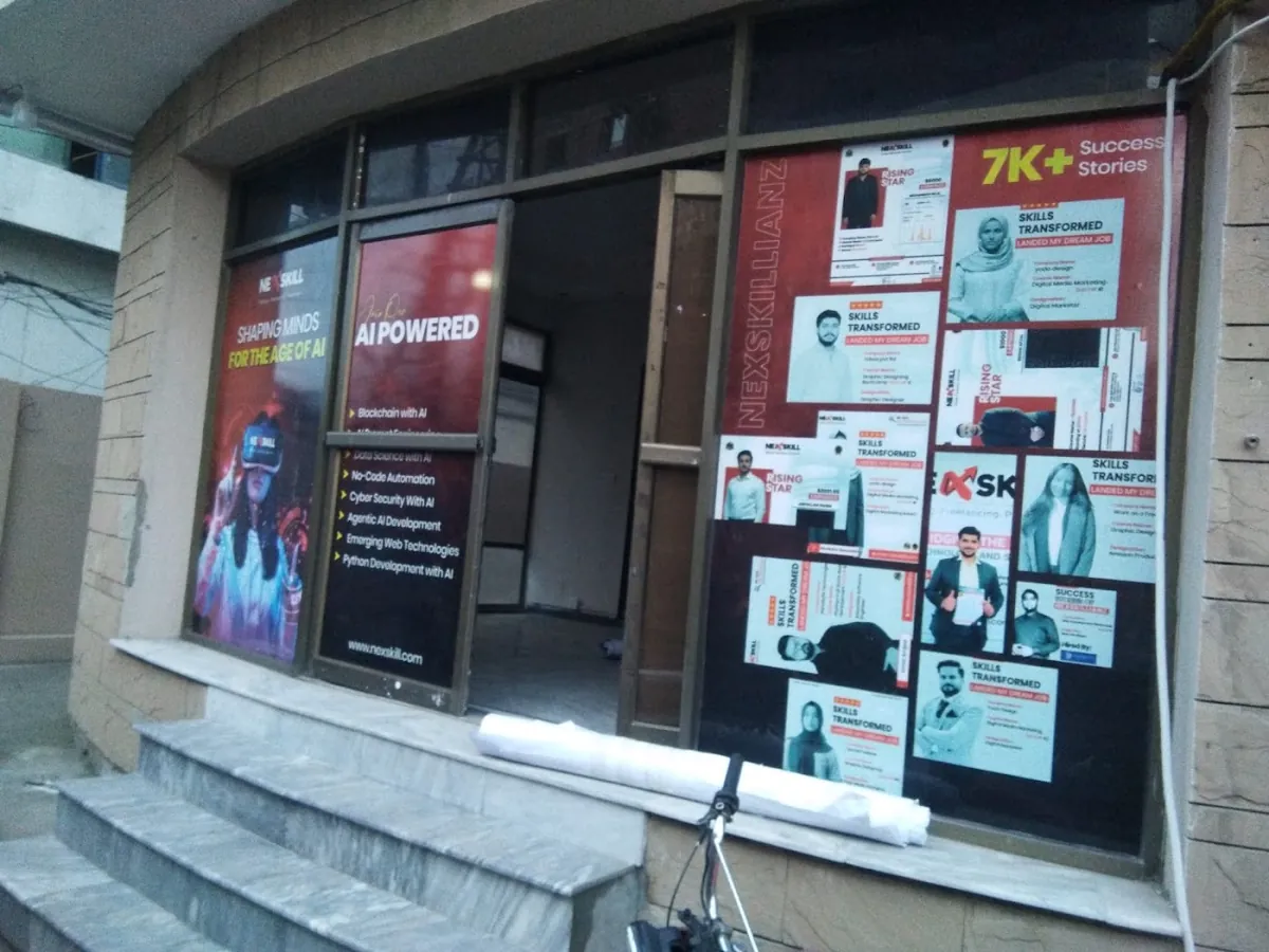 Red printed vinyl graphics covering the windows of an office building